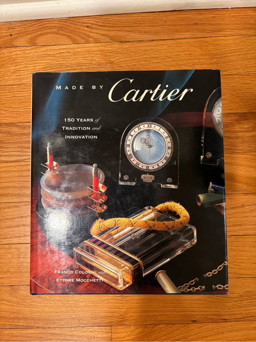 Cartier Hardcover Book — Black Cover with Gold and Red Accents